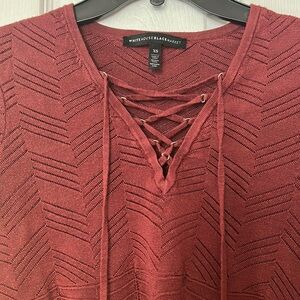 Long sleeve top with cross cross string across the chest